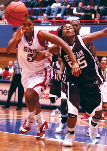 SMU forward Delisha Wills battles Texas A&M's forward Danielle Gant for the ball last season at Moody Colliseum. The Mustangs will be facing Houston tonight at 7 p.m. in Moody Colliseum.