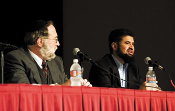 Rabbi Howard Wolk of Jewish Family Services listens as Imam Zia-ul-Haq Shaikh of the Islamic Center of Irving responds to questions students submitted before the forum began.
