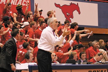 Coach Matt Doherty and a crowded student section cheer on the Mustangs as they play the Memphis Tigers Wednesday evening in Moody Colliseum. 