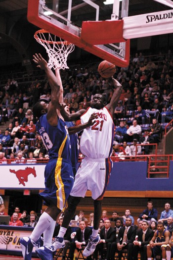 SMU center Bamba Fall goes for a dunk against Tulsa Saturday evening in Moody Coliseum.
