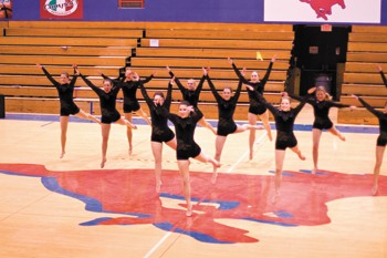 The SMU Pom squad performs their Nationals routine in a performance in Moody Coliseum in March. Teams from all over the Dallas area came to perform their routines before leaving for Daytona Beach, Flor.