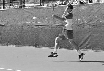 Artem Baradach returns the ball in a match against University of Texas at Arlington Tuesday at Turpin Tennis Stadium. 