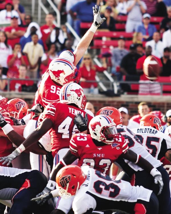 Freshman defensive lineman Margus Hunt jumps up to block a UTEP field goal during last Saturdays game.