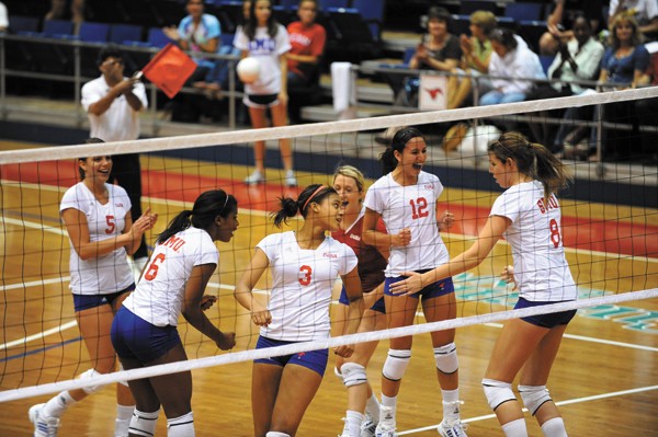 The SMU volleyball team celebrates a successful point against UNT at Moody Coliseum this fall.