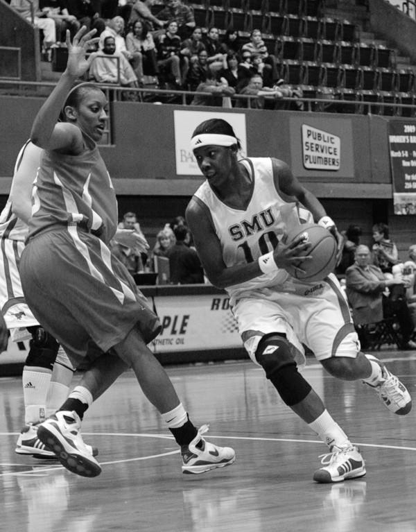 SMU forward Brittany Gilliam powers through the lane last semester during a victory over the Houston Cougars.