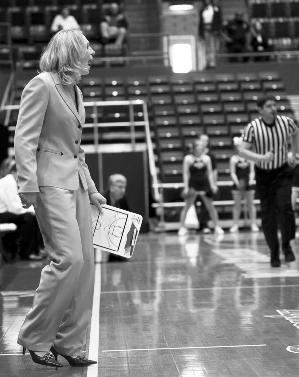 SMU women's basketball coach Rhonda Rompola speaks to the team during their game against Rice. KEVIN TODORA/The Daily Campus
