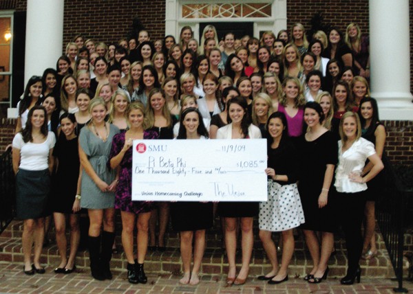 Members of Pi Beta Phi pose outside their house after receiving a check for winning The Union Homecoming Challenge last week. Photo courtesy of Lindsey Perry