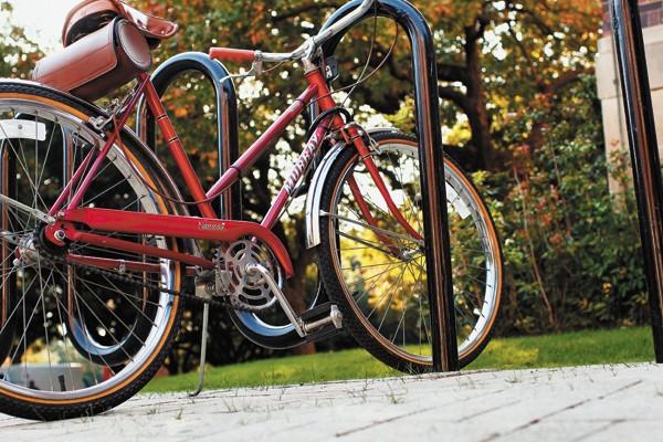 A bicylce rests locked to a bike rack outside of Hughes-Trigg Student Center Tuesday afternoon. CASEY LEE/The Daily Campus