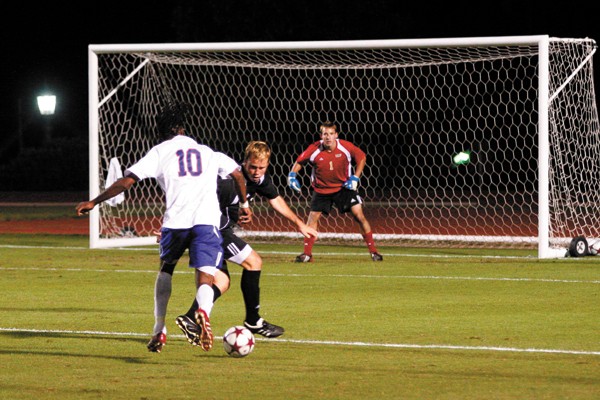SMU forward Dane Saintus drives past a UCF defender towards the goal last Saturday at Westcott Field. Saintus scored one goal in the Mustangs' 3-3 tie against the Knights. CASEY LEE/The Daily Campus
