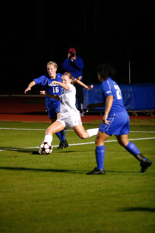 Ryanne Lewis, trying to escape from two Memphis players, looks for a teammate across the field to pass to. CASEY LEE/The Daily Campus