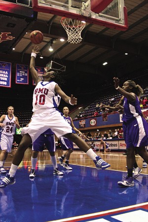 SMU guard Brittany Gilliam goes for a layup under the basket Wednesday night against TCU.