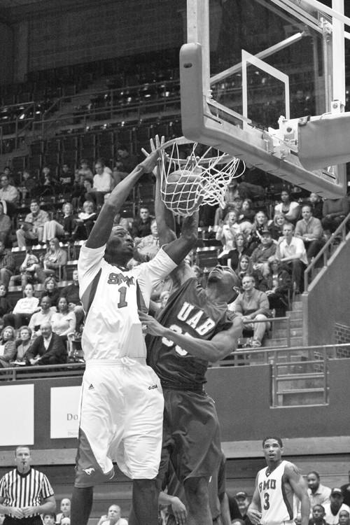 SMU forward Mouhammad Faye dunks in a game against UAB Jan. 16th at Moody Coliseum. The Mustangs lost the game, 63-62.