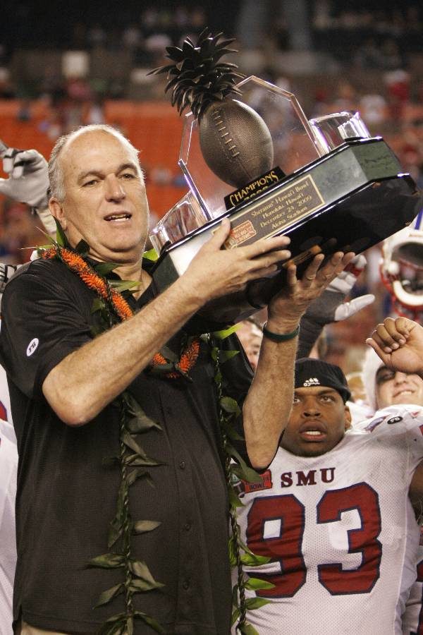 SMU+head+coach+June+Jones+holds+the+Hawaii+Bowl+trophy+after+SMU+defeated+Nevada+45-10+at+the+Hawaii+Bowl+NCAA+college+football+game%2C+Thursday%2C+Dec.+24%2C+2009%2C+in+Honolulu.+