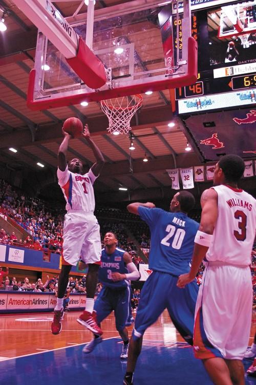 SMU guard Mouhammad Faye grabs a rebound during play against Memphis Saturday afternoon at Moody Coliseum.