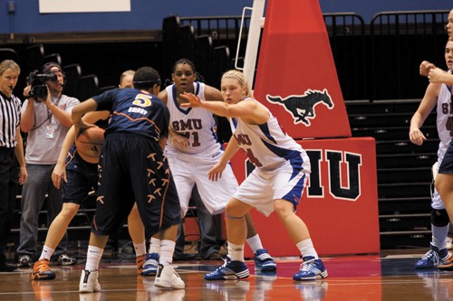 SMU forward Haley Day defends against a UTEP player preparing to take a shot.