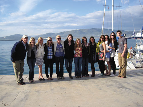 Some members pose in front of the Greek coast