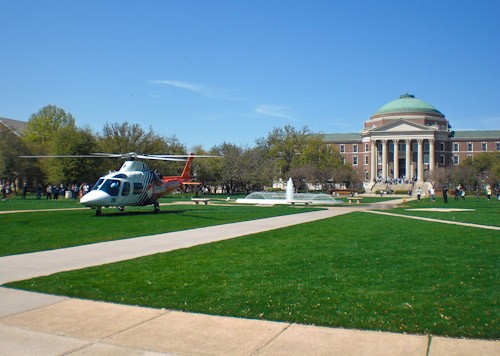 A CareFlite helicopter lands on the Main Quad.