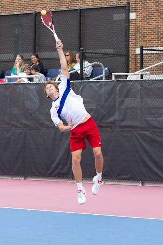 SMU junior Artem Baradach serving during a doubles match at Turpin Tennis Center.