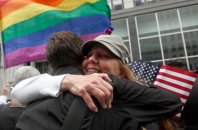Sheree Red Bornand, right, hugs Aidan Dunn after hearing the decision in the United States District Court proceedings challenging Proposition 8 outside of the Phillip Burton Federal Building in San Francisco, Wednesday, Aug. 4, 2010. A person close to the case says a federal judge has overturned Californias same-sex marriage ban in a landmark case that could eventually land before the U.S. Supreme Court. Chief U.S. District Judge Vaughn Walker made his ruling Wednesday in a lawsuit filed by two