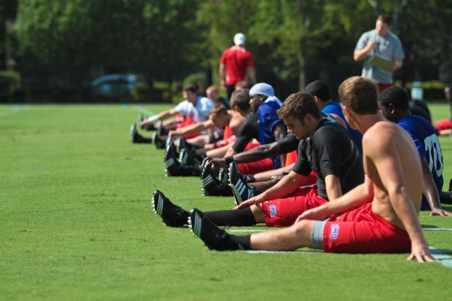 Members of the SMU football team stretch during their first practice of the 2010 season Saturday morning. 08/16/10