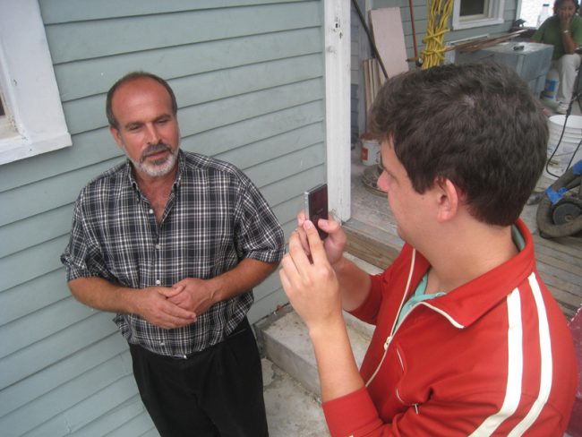 Journalism student Josh Parr interviews the subject of the first-year common reading, Abdulrahman Zeitoun, outside the house of one of Zeitoun’s clients on Claiborne Sunday, Aug. 29, 2010. 