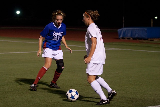 SMU Defender Courtney Smith, left, defends against Oklahoma State Midfielder Sarah Brown during play Friday night at Wescott Field. SMU lost the 