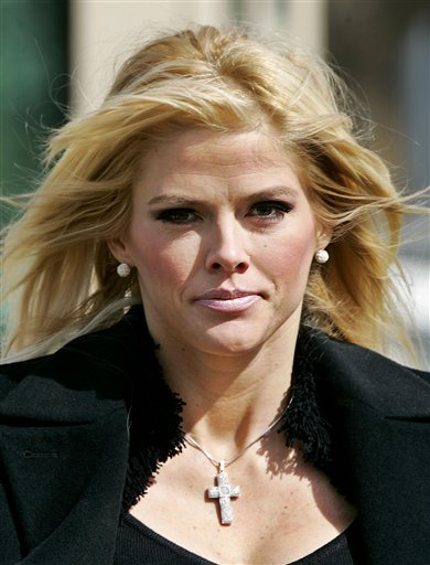 In this Feb. 28, 2006 file photo, Anna Nicole Smith, leaves the U.S. Supreme Court in Washington. The judge overseeing the drug conspiracy trial of Anna Nicole Smiths two doctors and lawyer-boyfriend on Thursday, Sept. 16, 2010 said he thinks part of the prosecutions case conflicts with state law.