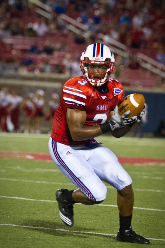SMU wide receiver Darius Johnson runs the ball after a catch from SMU QB Kyle Padron during play last Saturday.