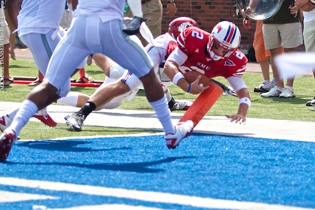 SMU quarterback Kyle Padron dives over the corner of the endzone after carrying the ball for SMU's first touchdown of the game Saturday afternoon, at Gerald J. Ford Stadium. (MICHAEL DANSER/The Daily Campus)