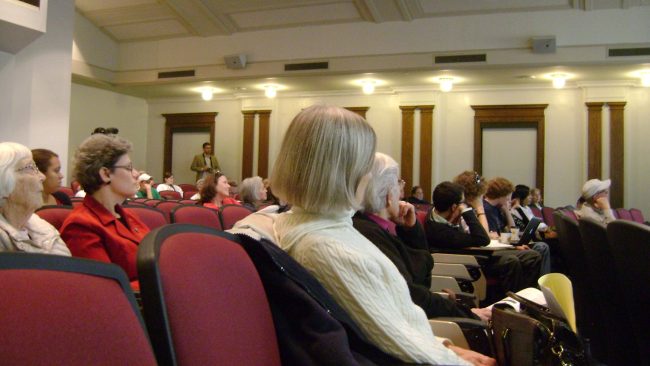 Audience members carefully listen as Professor Annas explains why doctors should not assist in lethal injection executions.