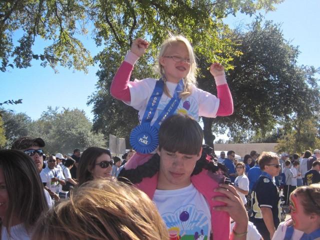 Nine-year-old Jordan Steele lines up with her cousin, Ben, before the kickoff of the Down Syndrome Guild of Dallas’ Buddy Walk at White Rock Lake Sunday afternoon.