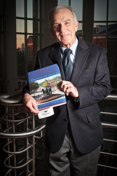 Official SMU centennial historian Darwin Payne with his new book, “In Honor of the Mustangs.”