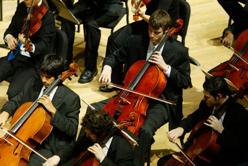 Senior cellist Zachary Reaves (top right) performs with the Meadows Symphony Orchestra. Reaves won the concerto competition with his performance of Cello Concerto in B Minor by Antonín Dvorák.