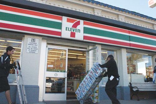 A delivery driver for Andrew’s Distributing rolls the store’s first shipment of beer into 7-Eleven on Hillcrest Avenue across from campus Thursday afternoon.