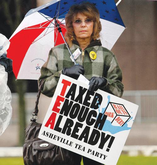 Jane Bilello of the Asheveille, N.C. Tea Party, demonstrates on the opening day of the North Carolina Legislature in Raleigh, N.C., Wednesday, Jan. 26, 2011.