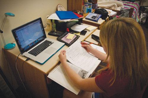 SMU freshman Jennifer Rogers studies for her sociology class involving family conflict Sunday evening inside of her residence hall living area. 