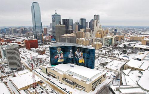The Omni Dallas Hotel stands in the foreground of this aerial view of snow-bound downtown Dallas on Friday.