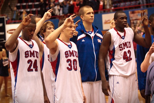 Members of the SMU basketball team sing the school alma mater, Varsity, after their win over Tulane University Wednesday Feb. 9 inside Moody Coliseum.
