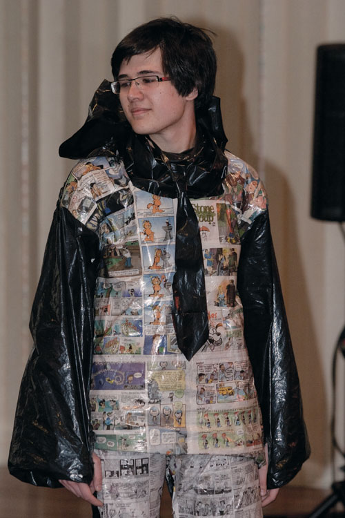 Matthew Bolaños shows off his garbage bag tie and newspaper jacket at the Eco-Friendly Fashion Show on Friday in the Hughes-Trigg Varisty. 
