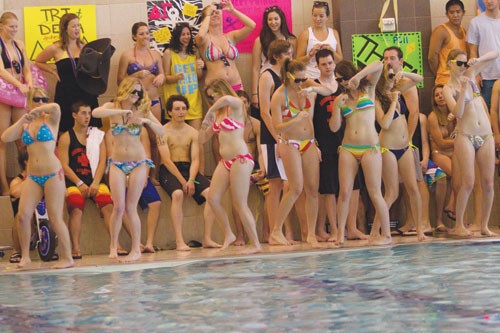 Members of the Alpha Chi Omega sorority perform the opening dance of their syncronized swimming routine for the Delta Gamma Anchor Splash philanthropy event Saturday afternoon at the Dedman Aquatic center.