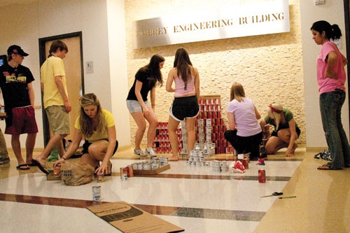 Engineering students use cans to construct a SMU-related strucutre in the Embrey building as part of a canned food drive competition. Students donated cans to their respected schools March 21 to April 2. The can designs will be on display this week. 