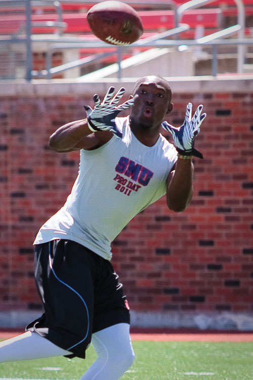 Former SMU wide receiver Aldrick Robinson catches a pass during SMU Pro Day. Scouts from various football organizations attended the event.