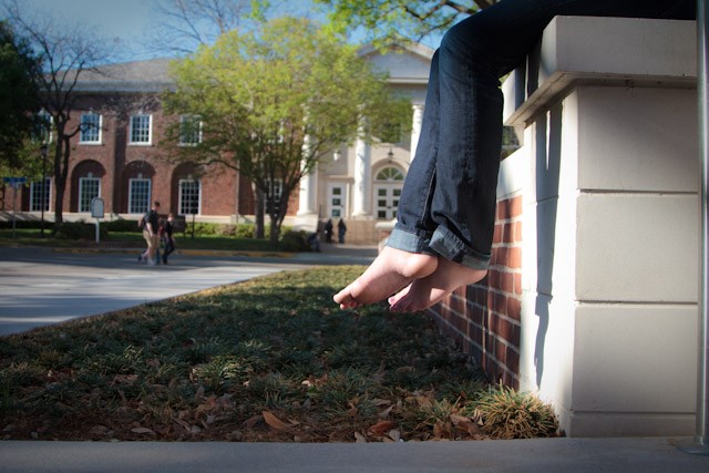 An SMU student participates in “A Day Without Shoes” by going the day without wearing shoes around campus. The event is organized annually by TOMS shoes to promote awareness for the millions of children who do not have shoes in the world.