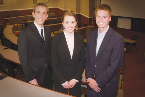 Vice President-Elect Alex Ehmke, from left, Secretary-Elect Martha Poole and President-Elect Austin Prentice pose for the Daily Campus Thursday evening.