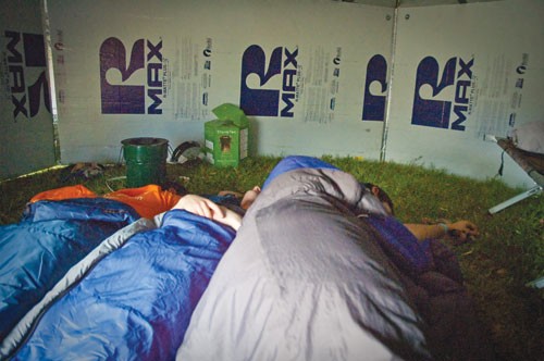 Three Lyle engineering students take an afternoon nap inside a yurt built for the Engineering and Humanity Week Living Village.