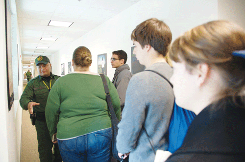United States Border Patrol officer Juan Guajardo gives a tour of the Tucson Sector Border Patrol office to SMU students who took part in the United States-Mexico Research Project Mexico symposium this past January.