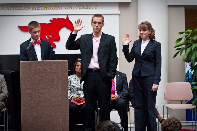 Incoming Student Body President Austin Prentice, left, swears in incoming Student Body Vice-President Alex Ehmke and incoming Student-Body Secretary Martha Poole Tuesady afternoon in the Hughes-Trigg Commons.