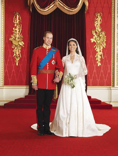 Britain’s Prince William, left, and his wife Kate, Duchess of Cambridge, pose for a photograph in the throne room at Buckingham Palace, following their wedding at Westminster Abbey, London, on Friday. 