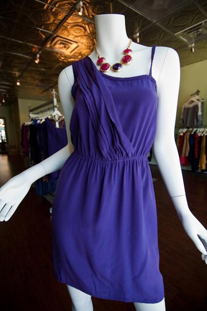 Pieces+Boutique+carries+a+variety+of+colorful%2C+silky+dresses.