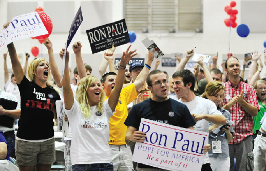 Ron Paul supporters celebrate their second place finish in the Georgia Republican Party’s fish fry in Perry, Ga. on Saturday, Aug. 27, 2011. Businessman and radio show host Herman Cain, also from Georgia, won the ballot with 232 votes, Texas U.S. Rep. Ron Paul was second with 229 votes and Texas Gov. Rick Perry was third with 180. 